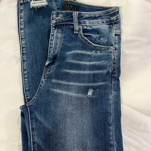 Risen distressed skinny jeans - size 7/28. Chewed hem. Excellent condition.